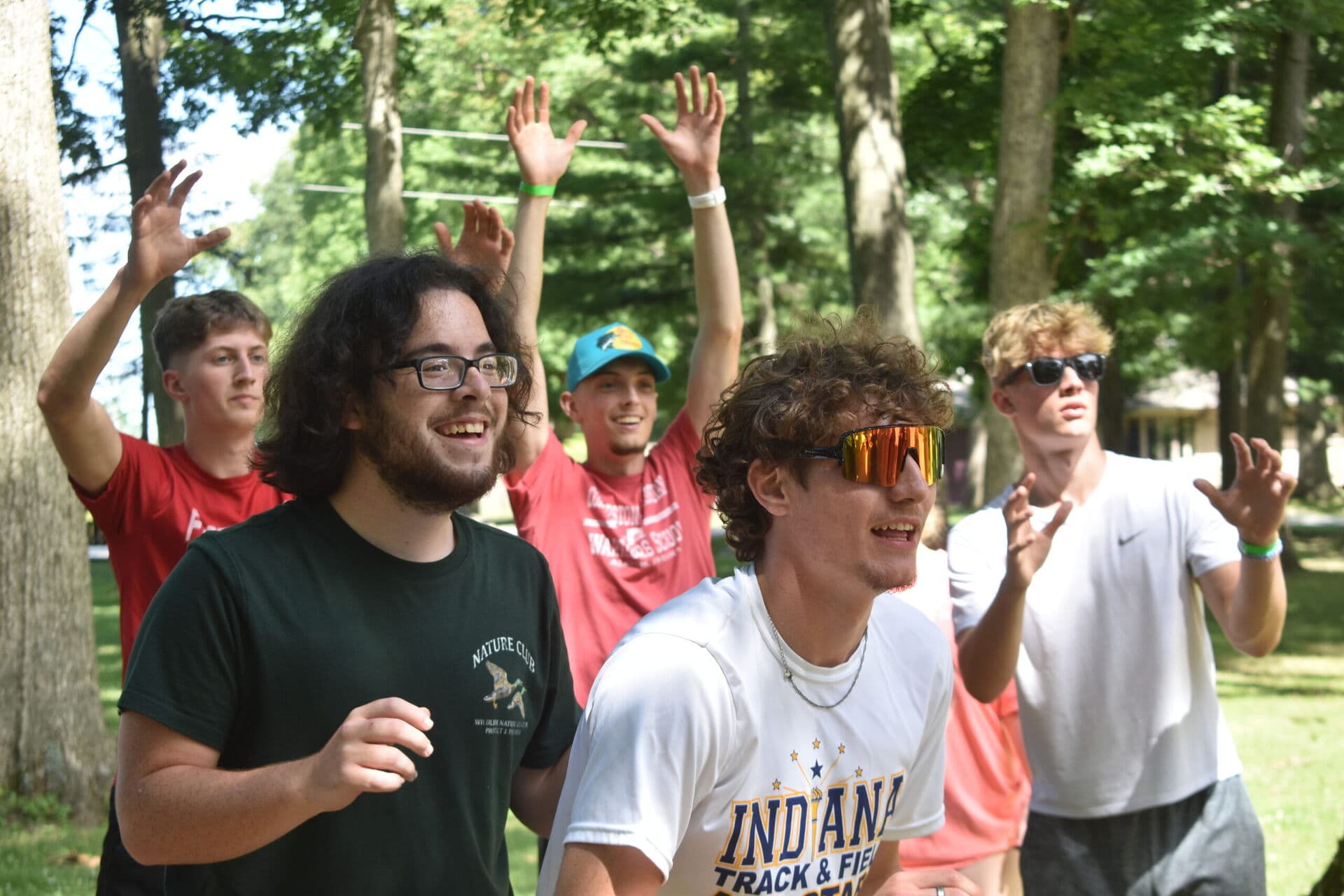 Summer staff members leading activities with campers